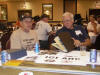 (069) Hartson Gleason and Phil Crouse looking over some the picture albums